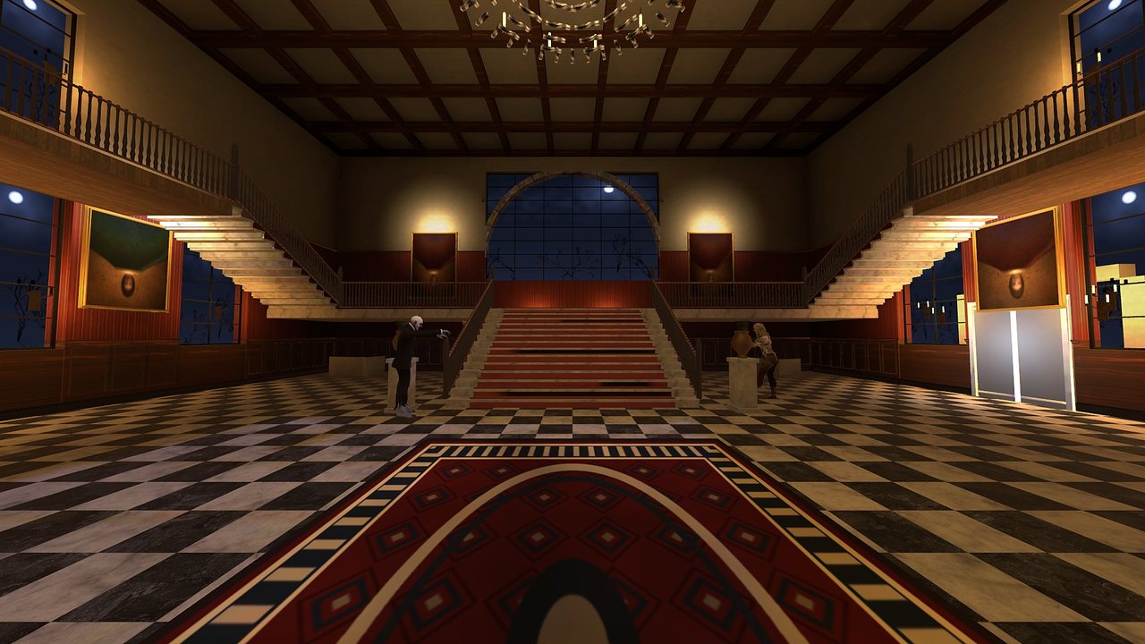The grand foyer with its double staircase and moon window