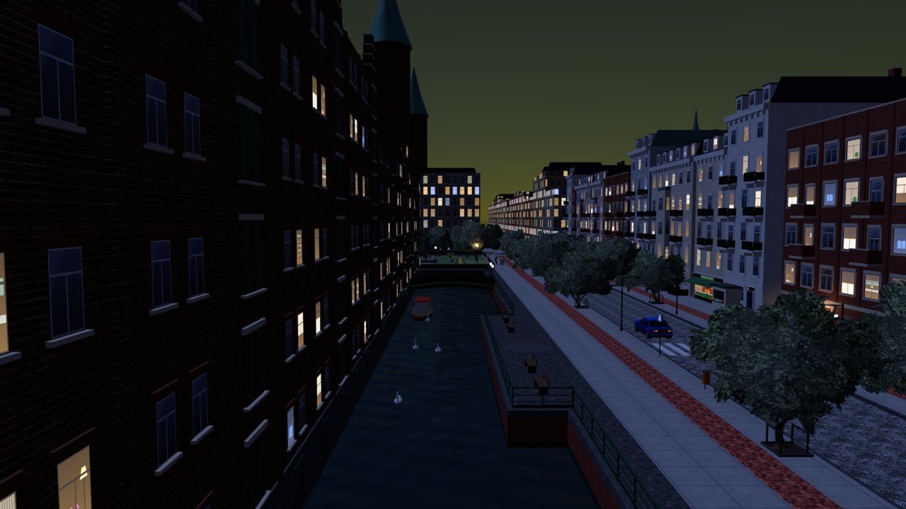 The canal at night with the warehouse windows lit