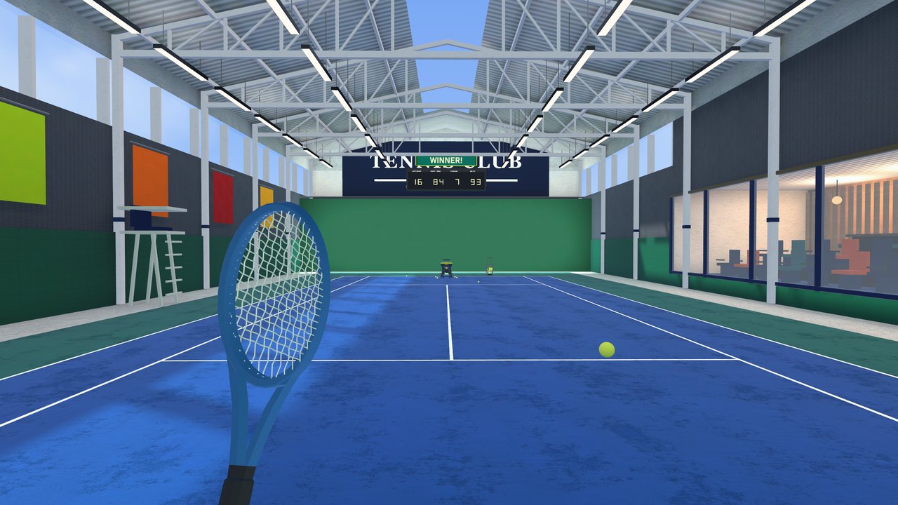 The racket in hand at the baseline of the indoor court