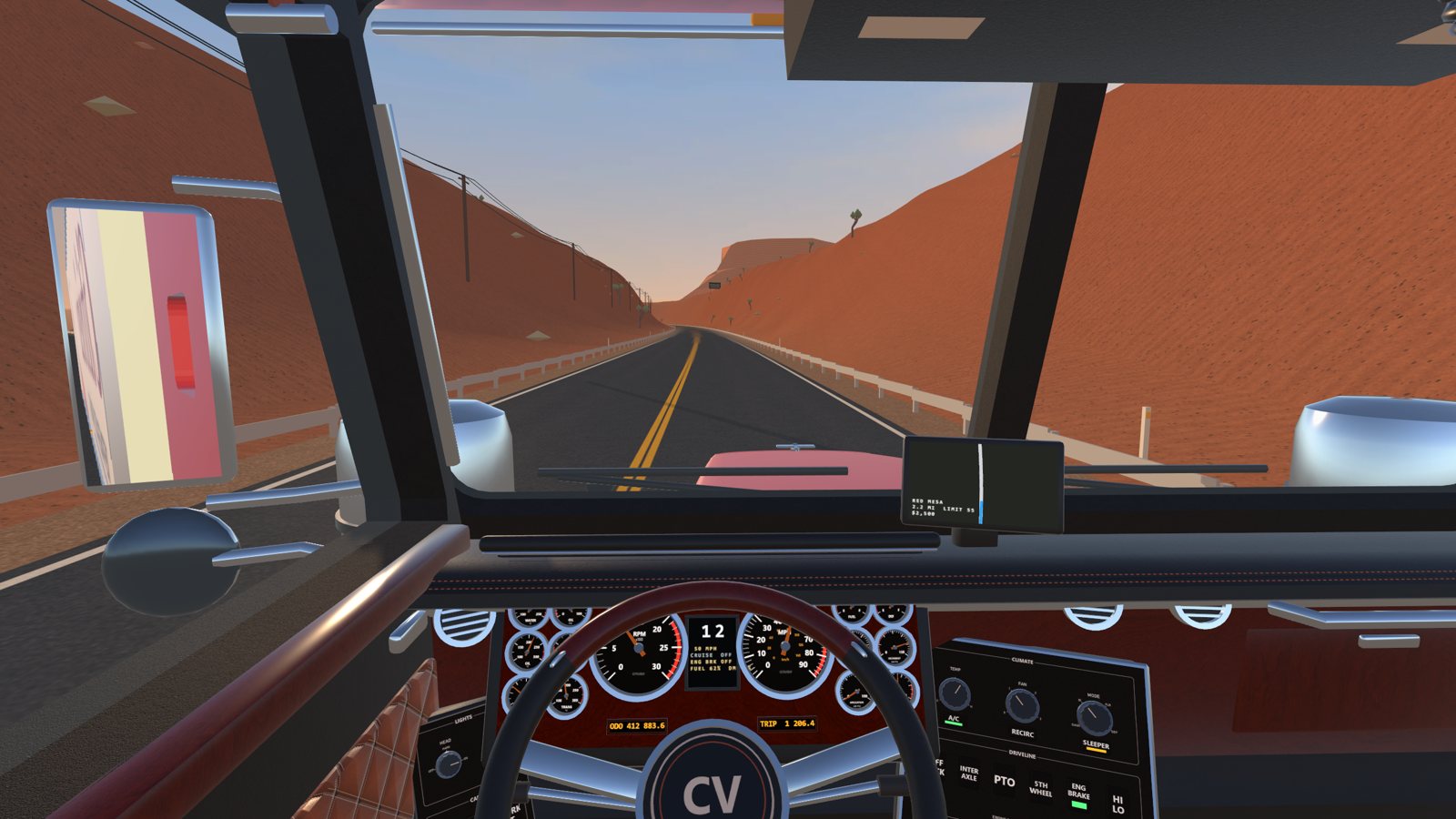 The driver's view down a desert highway at golden hour