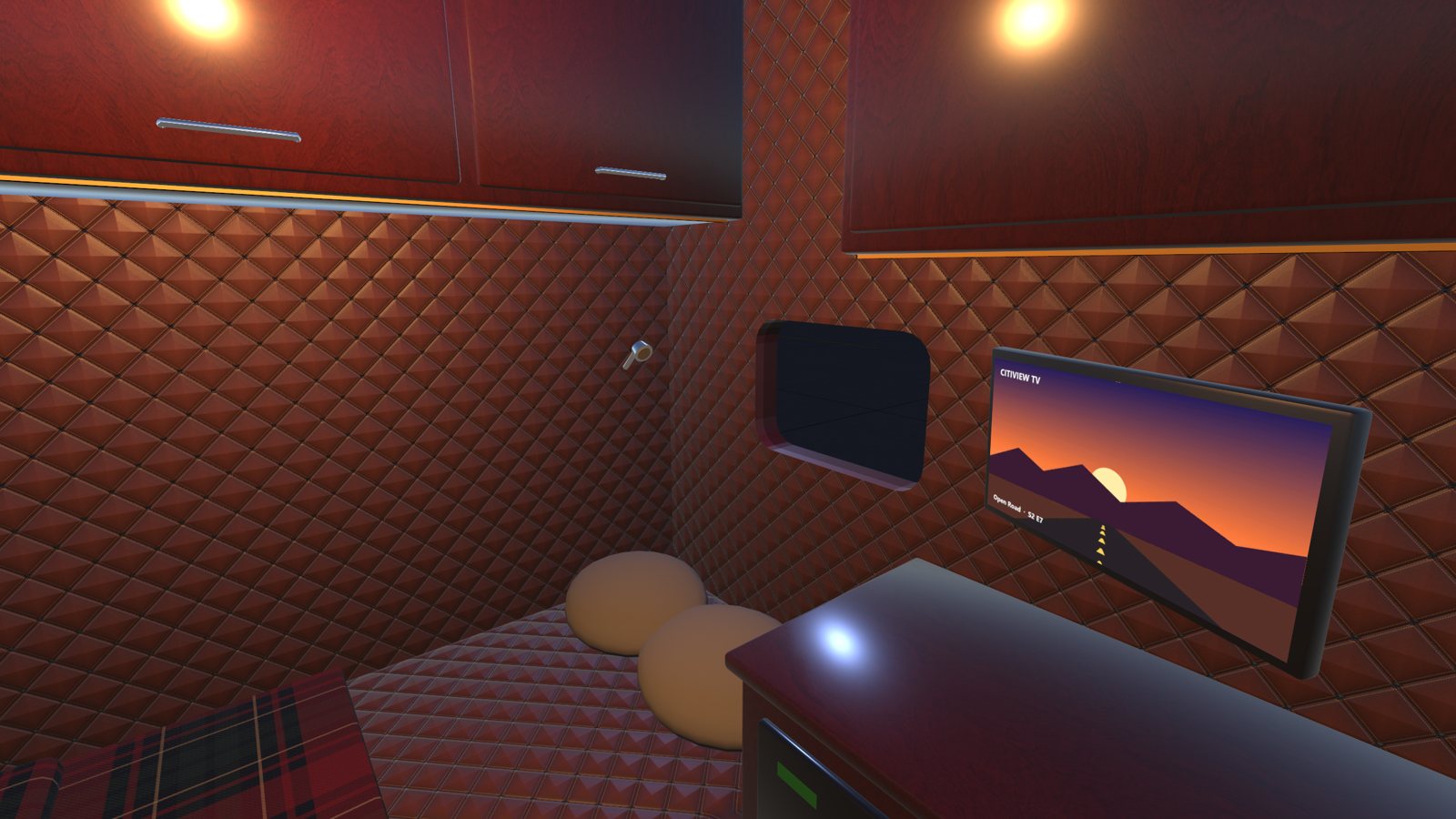 The sleeper: bunk, TV and quilted walls